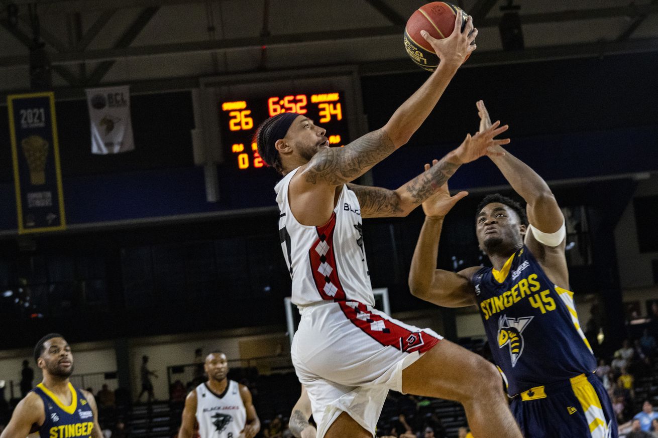 Tyell Tate (L) of Ottawa Blackjacks and Somto Dimanoche (R)...