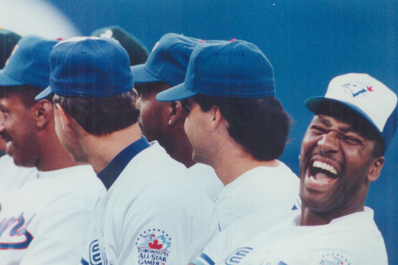 Jolly Joe: Blue Jay outfielder Joe Carter erupts in laughter after a slight snafu over the introduct