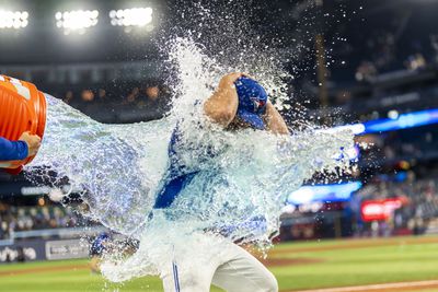  Toronto Blue Jays outfielder Davis Schneider (36) gets dumped with Gatorade after defeating the New York Yankees at Rogers Centre.