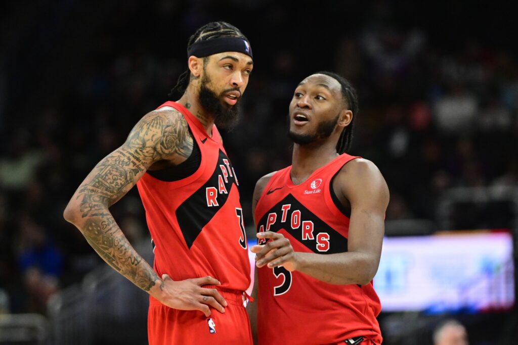 Toronto Raptors guard Immanuel Quickley (5) talks to forward Brandon Ingram (3) in the second quarter against the Milwaukee Bucks at Fiserv Forum.